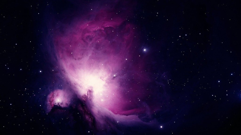 Orion nebula. Bright violet light with stars all around.